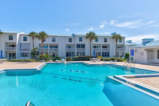 view of swimming pool with a patio