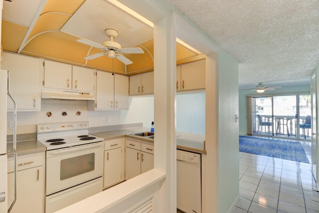 kitchen featuring ceiling fan, light tile patterned floors, a textured ceiling, and white appliances