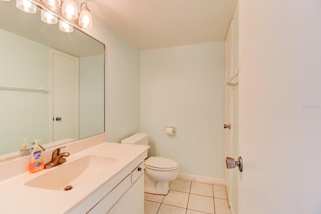 bathroom with vanity, toilet, and tile patterned flooring