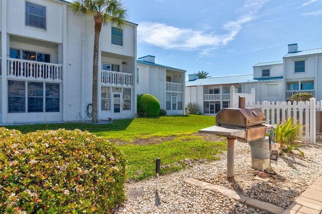 view of community featuring a lawn