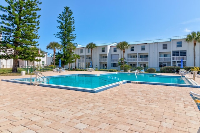 view of swimming pool featuring a patio