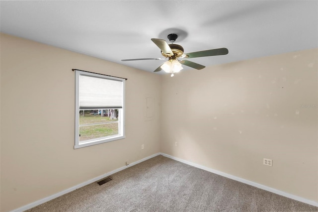 spare room with ceiling fan and carpet floors