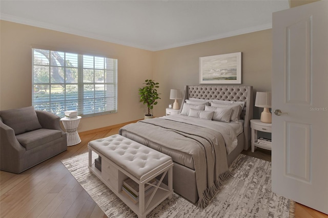 bedroom featuring hardwood / wood-style flooring and ornamental molding