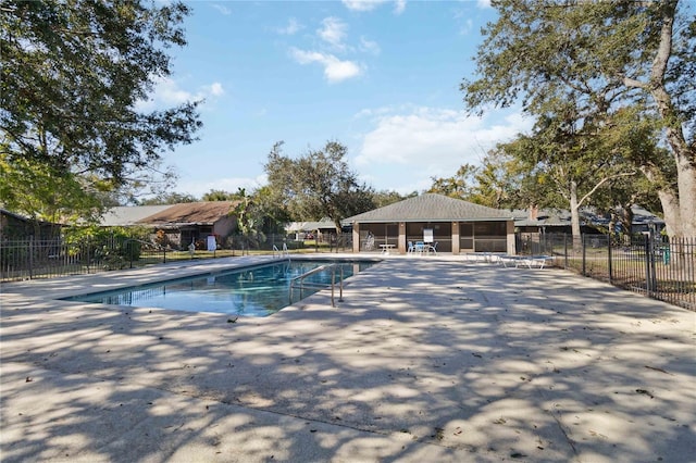 view of swimming pool with a patio area