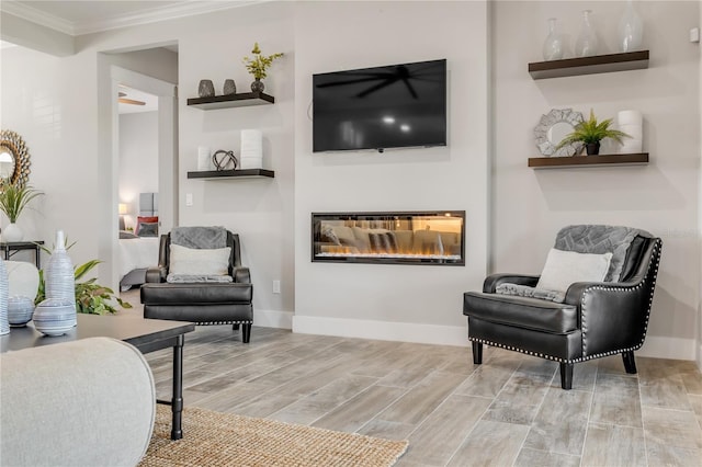 sitting room featuring crown molding