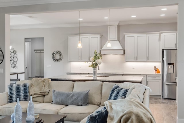 living room featuring crown molding