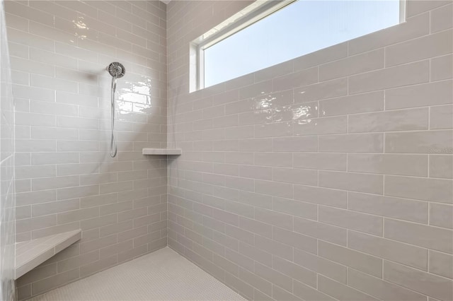 bathroom featuring tiled shower