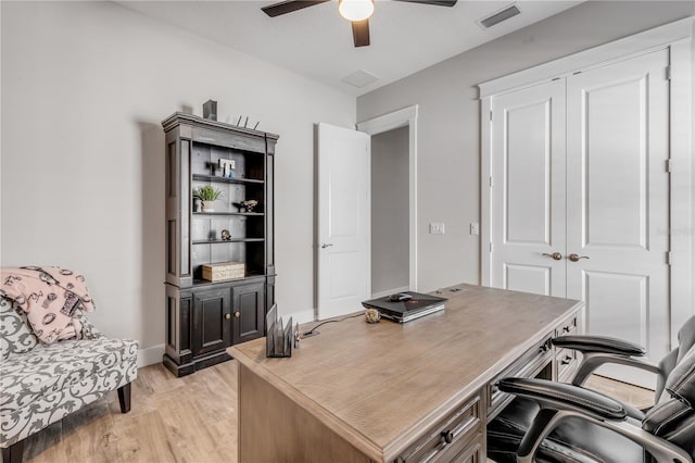 home office featuring ceiling fan and light wood-type flooring