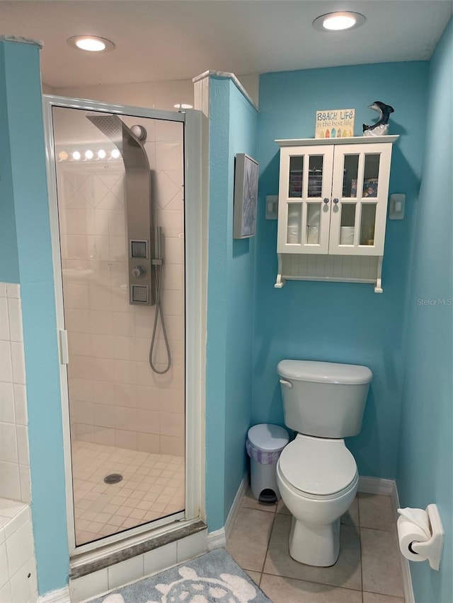 bathroom with toilet, an enclosed shower, and tile patterned flooring