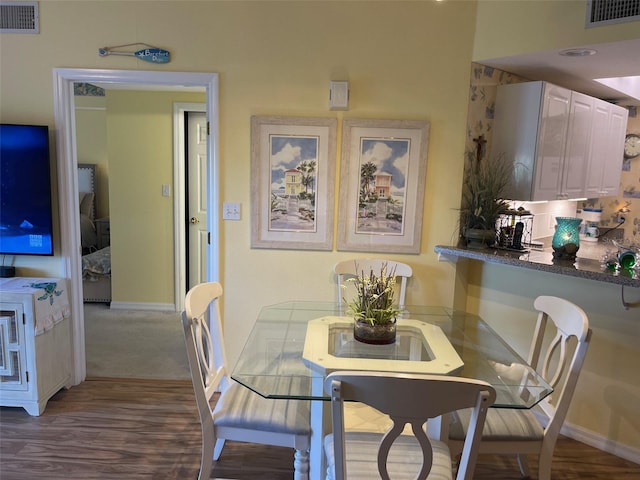 dining area with hardwood / wood-style floors