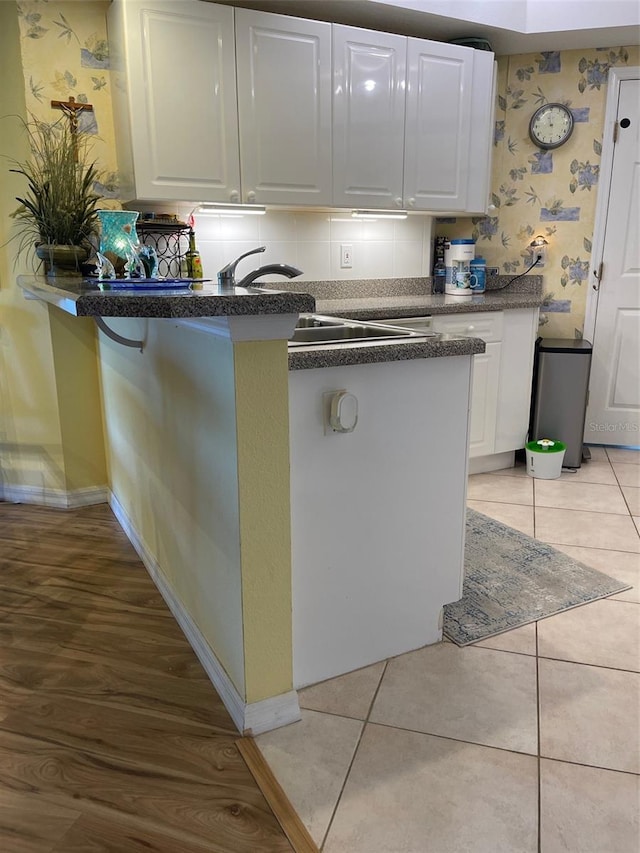 kitchen featuring white cabinetry and light tile patterned floors