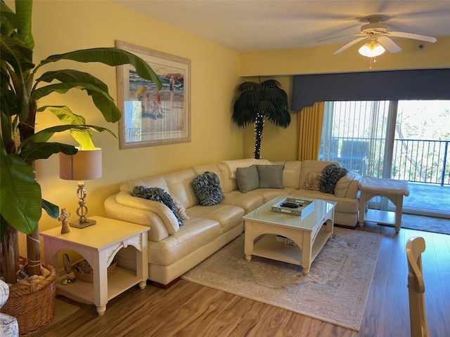 living room featuring hardwood / wood-style flooring and ceiling fan