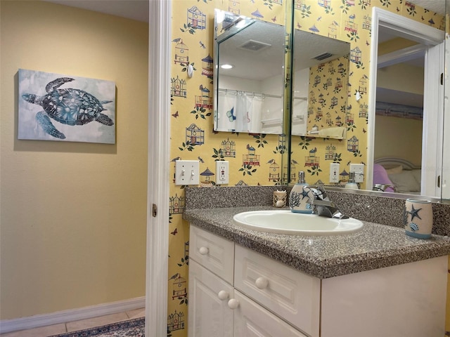 bathroom with vanity and tile patterned flooring