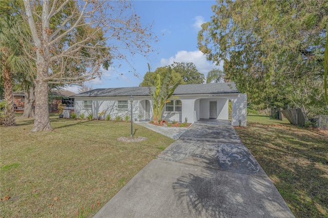 ranch-style house with a carport and a front yard