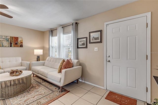 living room with light tile patterned floors and ceiling fan