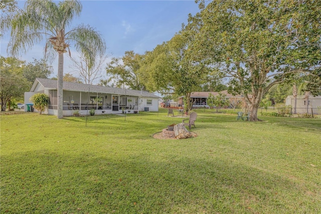 view of yard with a sunroom