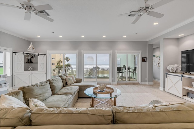 living room with crown molding, ceiling fan, and light tile patterned floors