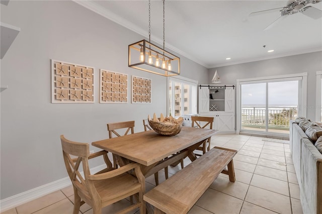 dining area featuring ornamental molding, ceiling fan, and light tile patterned flooring