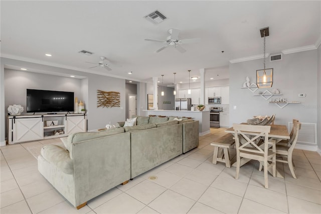 living room featuring crown molding, ceiling fan, and light tile patterned flooring