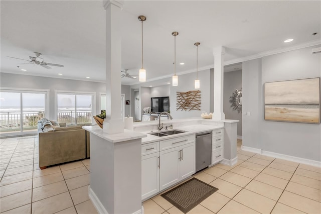 kitchen featuring hanging light fixtures, white cabinetry, and crown molding