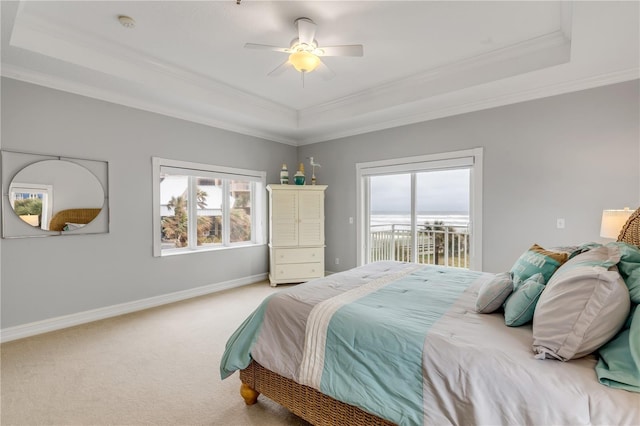 bedroom featuring access to outside, a raised ceiling, ceiling fan, and carpet flooring