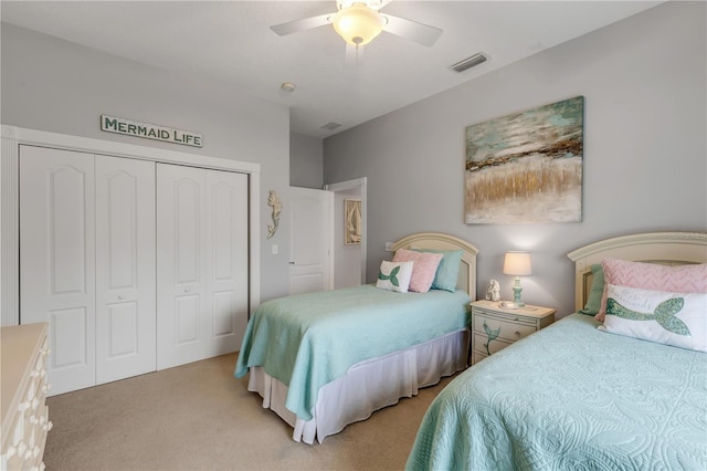 carpeted bedroom with a closet and ceiling fan