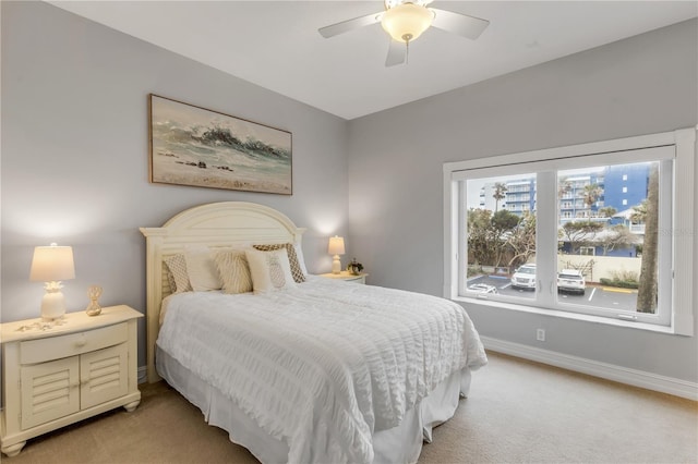 bedroom with light colored carpet and ceiling fan