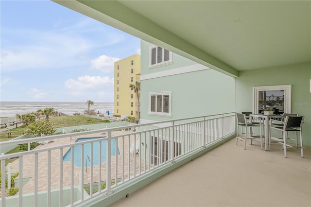 balcony featuring a water view