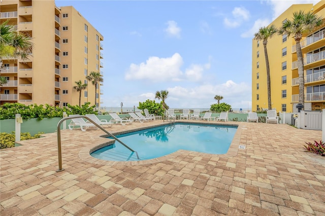 view of swimming pool featuring a patio area