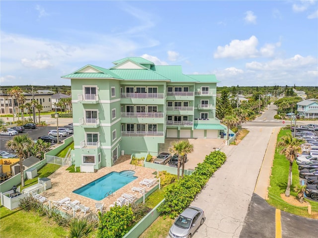 view of property featuring a community pool