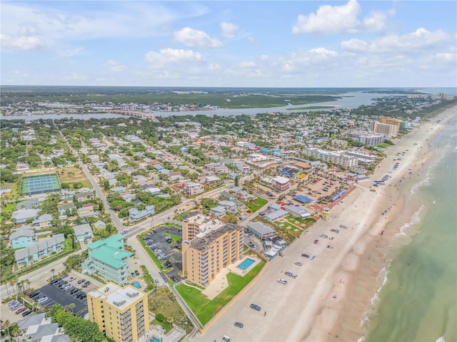 birds eye view of property with a view of the beach and a water view