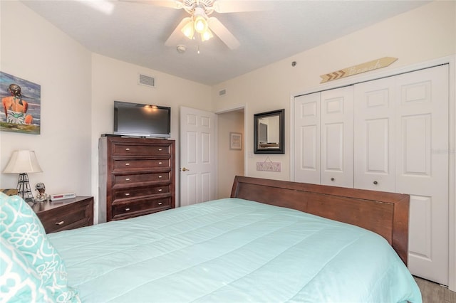 bedroom with ceiling fan and a closet