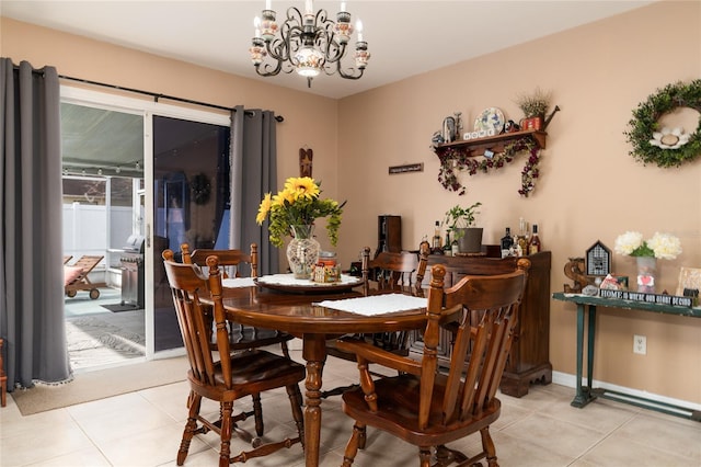 tiled dining area featuring an inviting chandelier