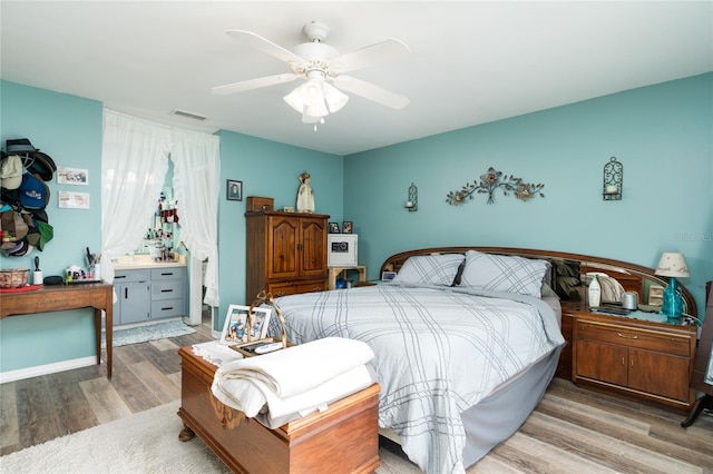 bedroom featuring hardwood / wood-style flooring and ceiling fan