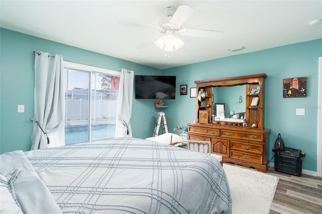 bedroom with access to outside, ceiling fan, and light wood-type flooring