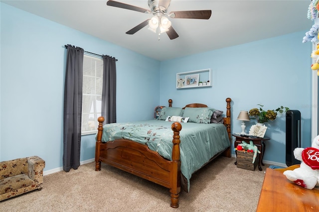 bedroom featuring ceiling fan and light colored carpet