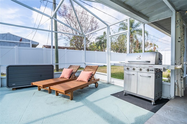 view of patio / terrace featuring grilling area and glass enclosure