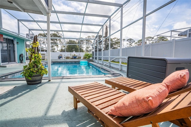 view of pool featuring a lanai and a patio