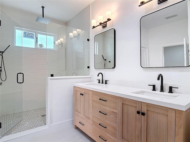 bathroom with vanity and an enclosed shower