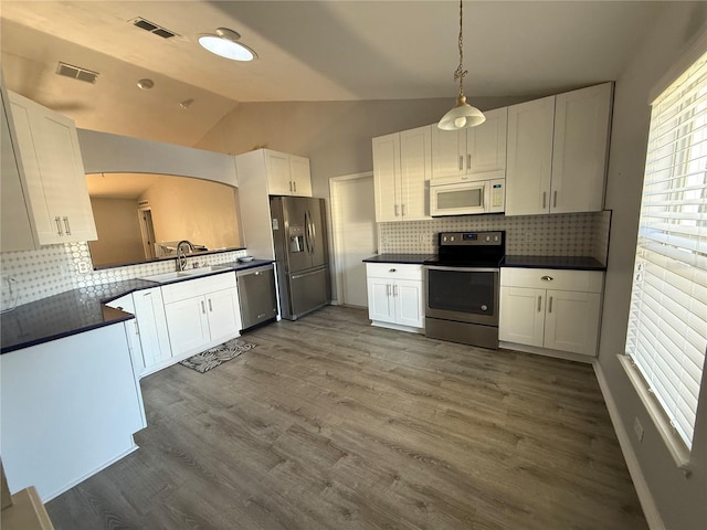 kitchen with white cabinetry and appliances with stainless steel finishes