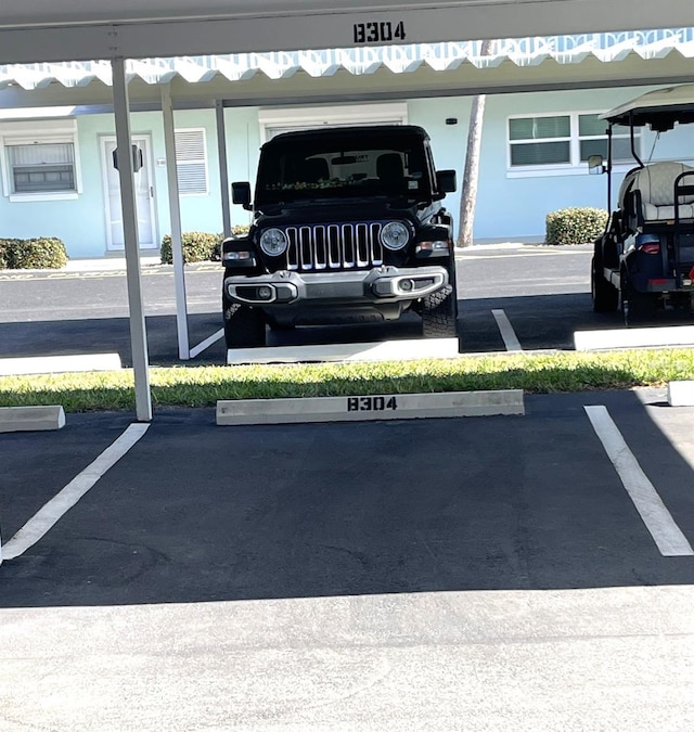 view of car parking featuring a carport