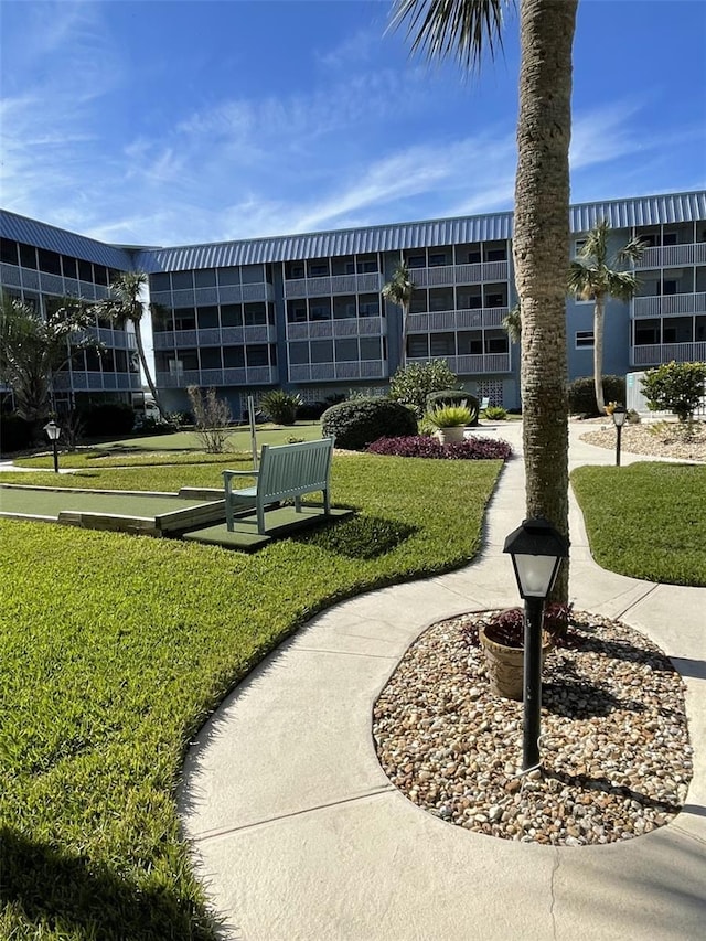 view of home's community featuring a yard