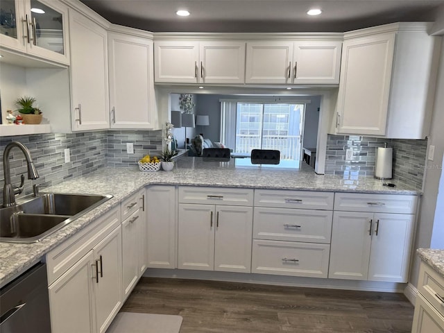 kitchen featuring white cabinetry, sink, dark hardwood / wood-style flooring, and black dishwasher