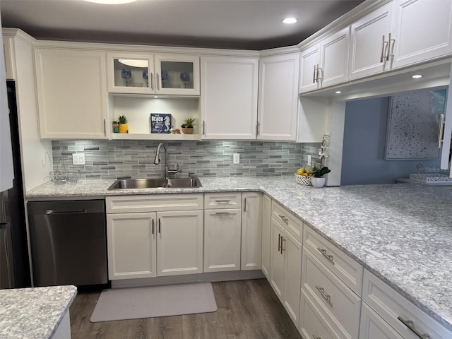 kitchen featuring white cabinetry, dark hardwood / wood-style floors, dishwashing machine, and sink