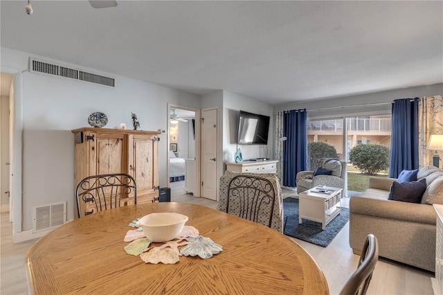 dining space with ceiling fan