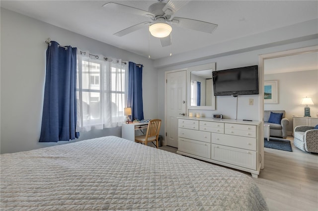 bedroom featuring ceiling fan and light wood-type flooring