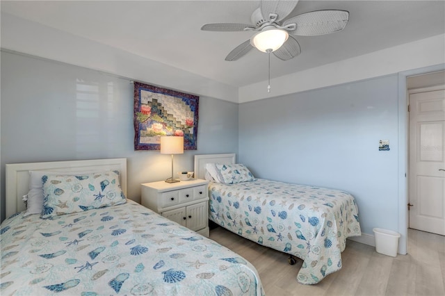 bedroom with ceiling fan and light wood-type flooring