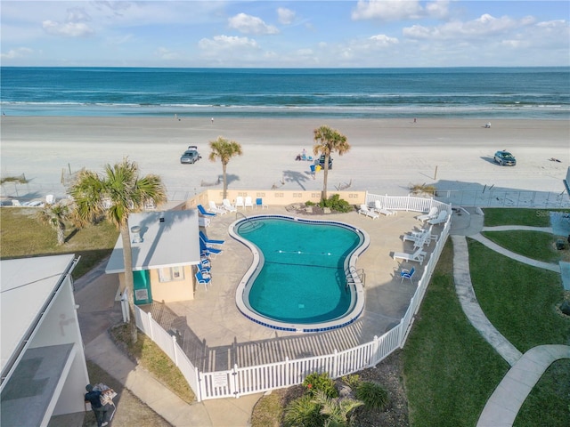 bird's eye view featuring a beach view and a water view