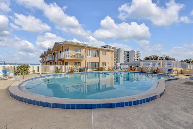 view of swimming pool featuring a patio area