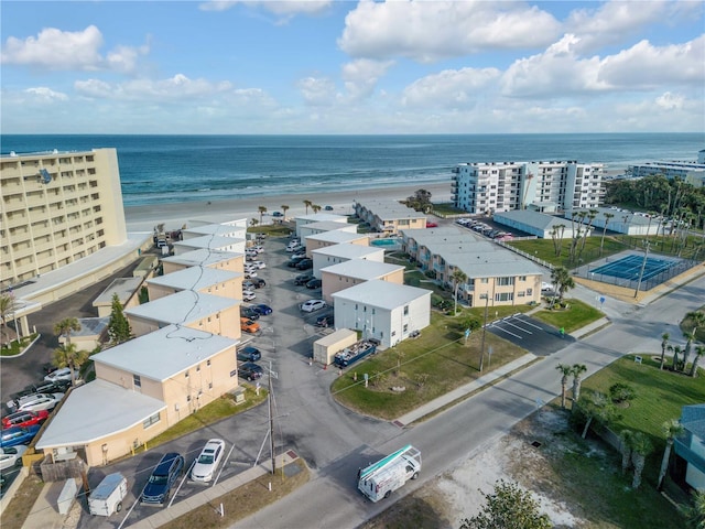 aerial view featuring a water view and a beach view